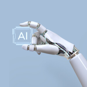 Robot hand holding chip that says AI