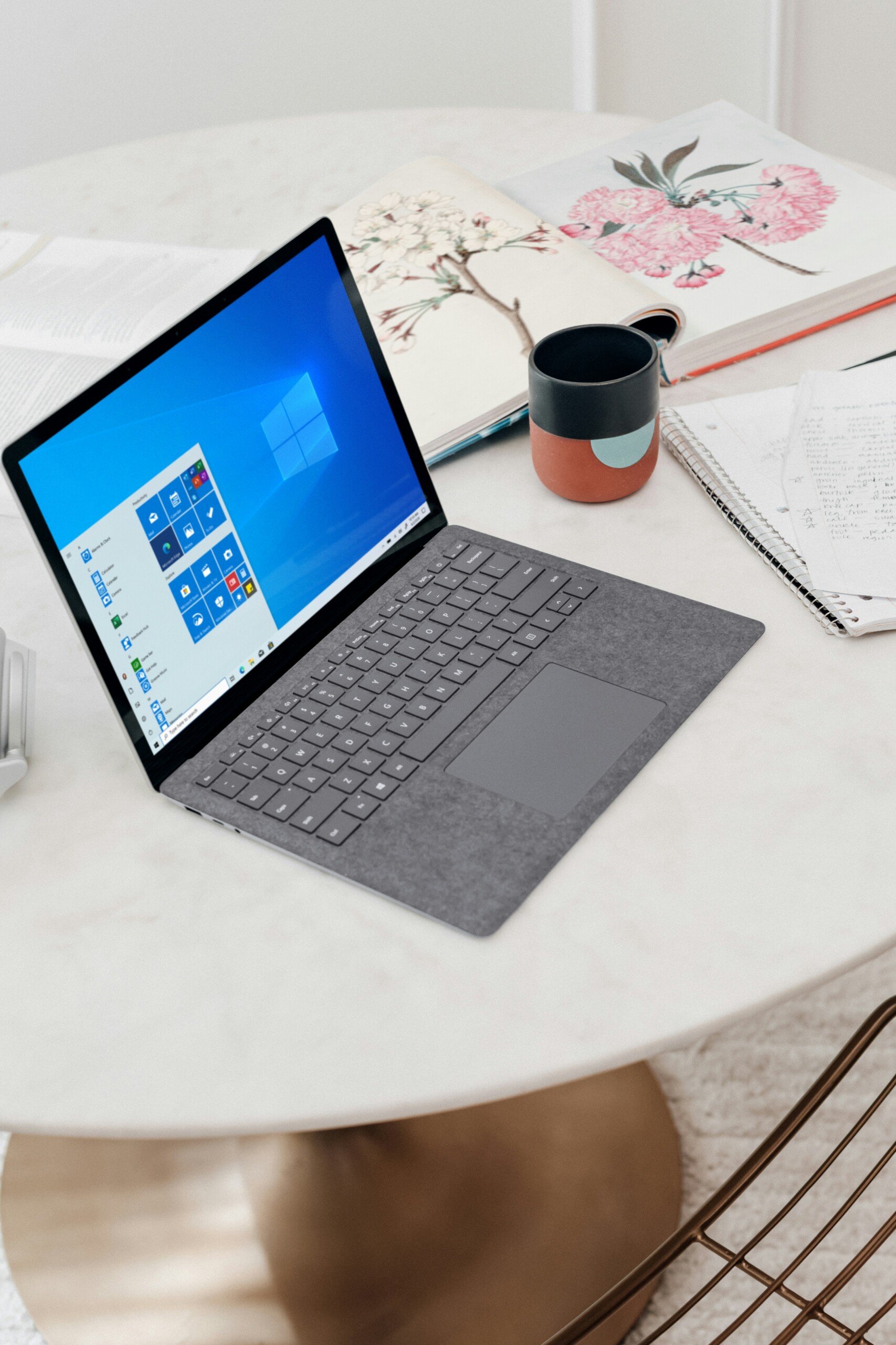 Microsoft computer on top of a white table